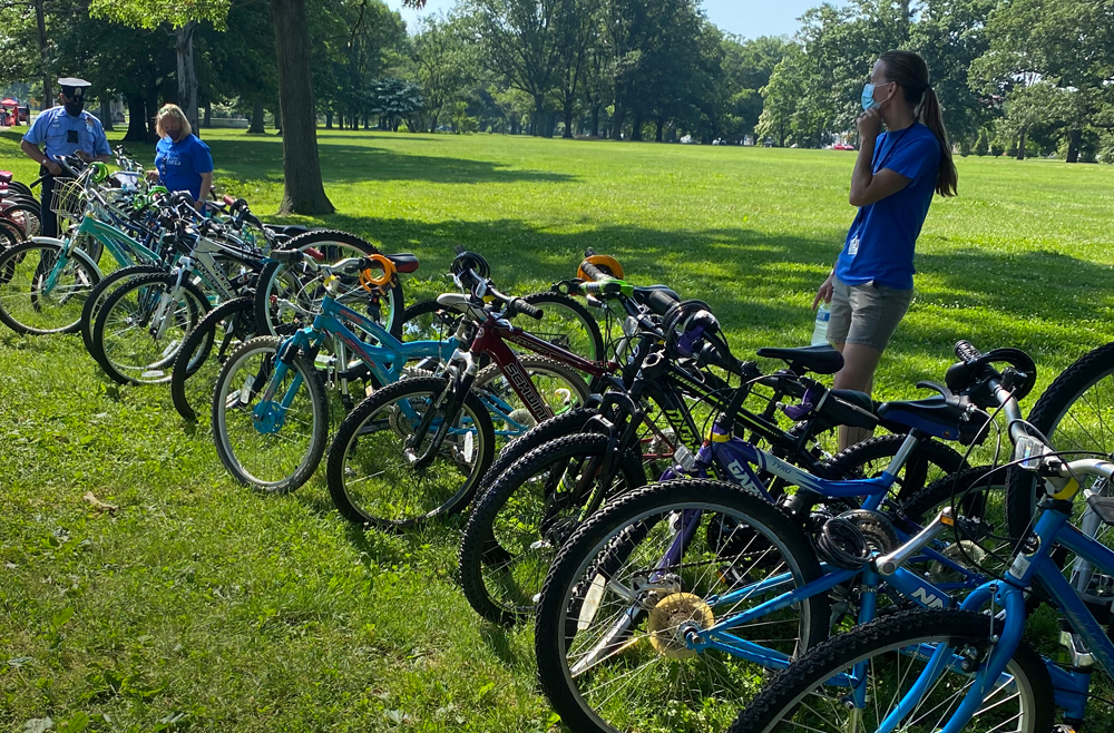 Over 80 bikes lined up in Fairmont Park outside of the Please Touch Museum, ready to be donated 